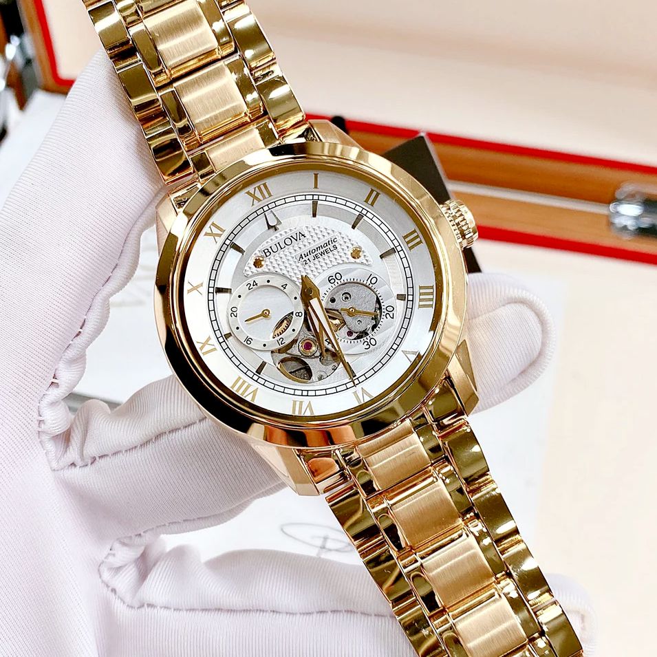 Bulova Relógio masculino clássico Sutton automático com 4 ponteiros, submostrador 24 horas, abertura aberta, corda automática, 97A108 – Dourado