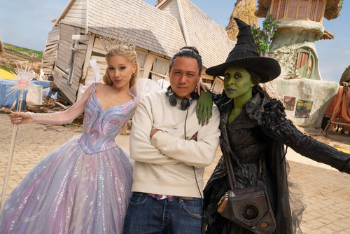 L to R: Ariana Grande (as Glinda), Director Jon M. Chu, and Cynthia Erivo (as Elphaba), on the set o.jpg