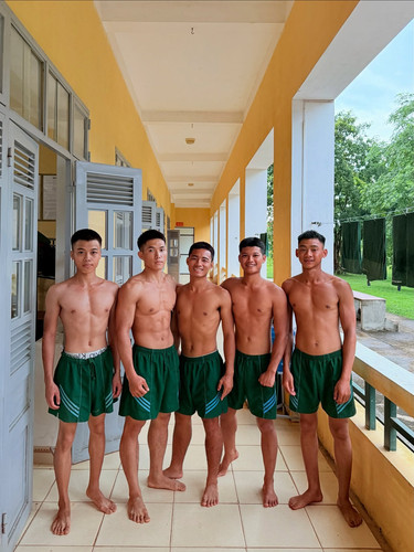 Photo by Phạm Công Đạt on August 24, 2025. May be an image of 5 people, shorts, sarong and text..jpg