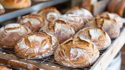 freshly baked artisan bread loaves decorative scoring showcased bakery rack artisan breads display l.jpg