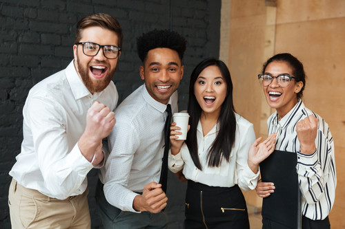 happy excited young business colleagues make winner gesture.jpg