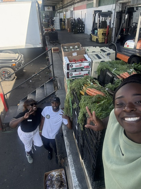 Group of men and volunteers smiling