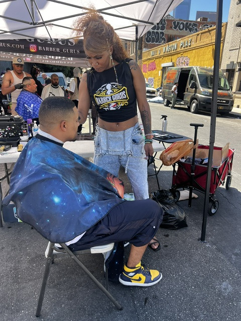 Barber and young client interaction