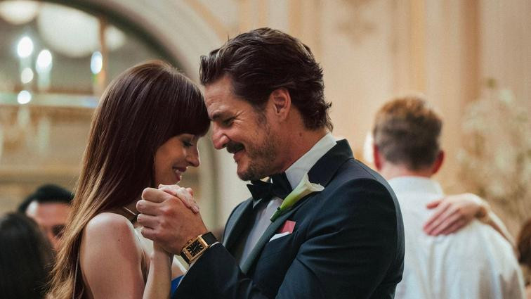 A couple slow dancing and smiling