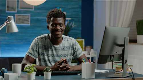 Man working from home using computer and keyboard.jpg