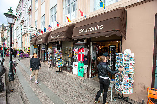 Copenhagen, Denmark  - September 10, 2014: People buying souvenirs in gift shop on Copenhagen street.jpg