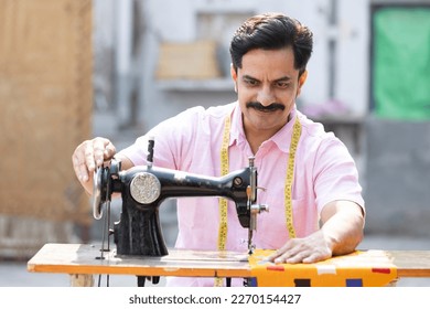 man sewing clothes machine 260nw 2270154427.jpg