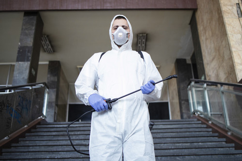 portrait man white protection suit with sprayer tank ready fight against corona virus.jpg