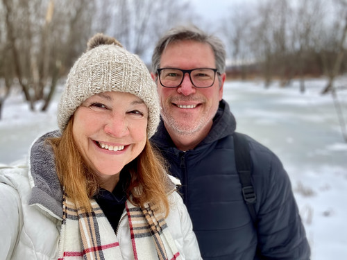 Smiling middle age couple outdoors in winter taking a selfie.jpg