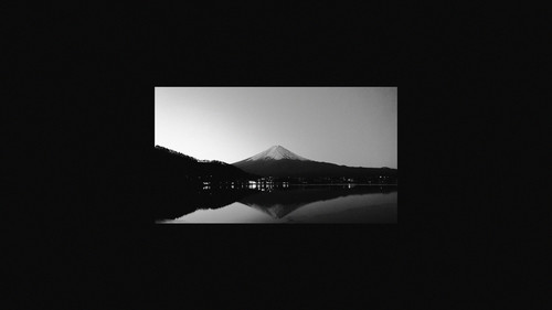 a mountain with a lake in the background.jpg