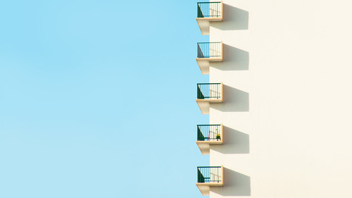 a white building with balconies.jpg