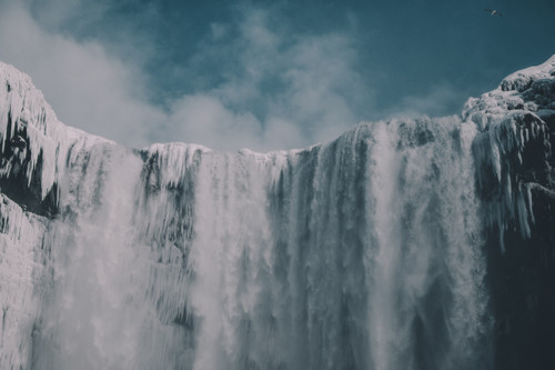 a large waterfall with snow and ice.jpg