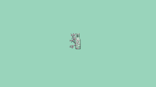 a bottle with a branch on it.png