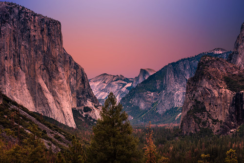 a mountain range with trees and a valley.jpg