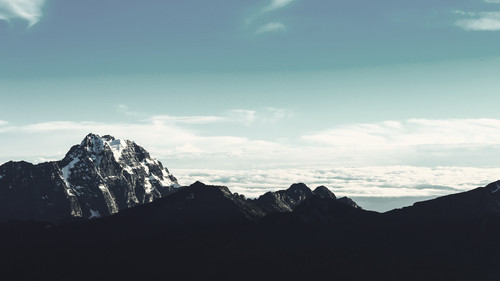 a mountain range with snow on top 01.jpg