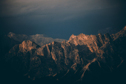 a mountain range with dark clouds.jpg