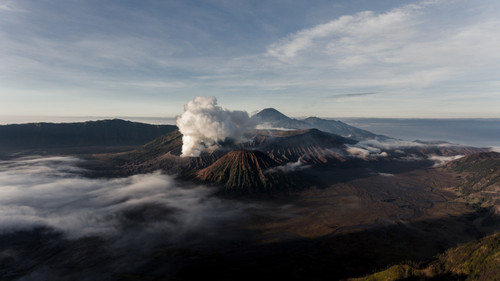 a mountain with smoke coming out of it.jpg