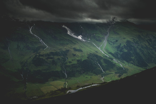 a mountain with a road going through it.jpg
