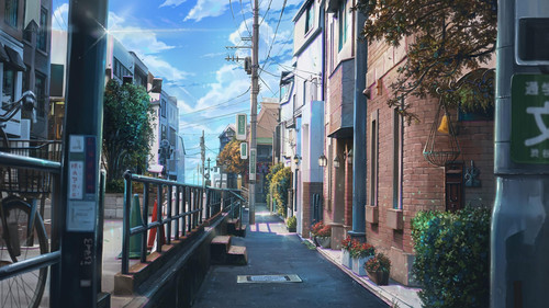 a street with buildings and a railing.jpg