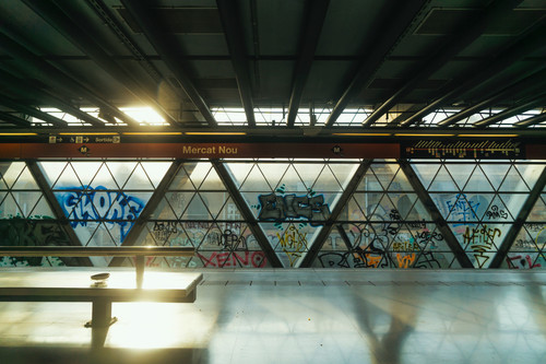 a room with a table and graffiti on the wall.jpg