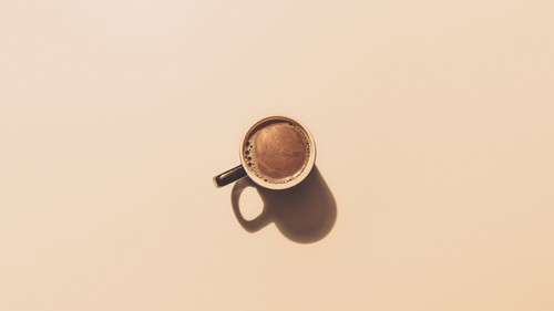 a cup of coffee with foam.jpg