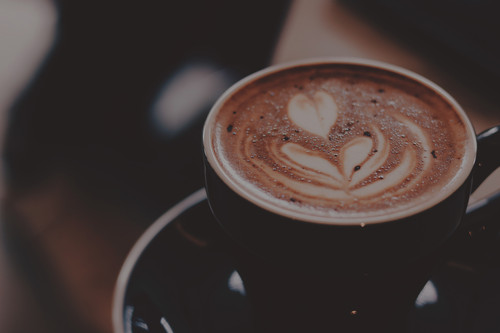 a cup of coffee with a heart design on top.jpg