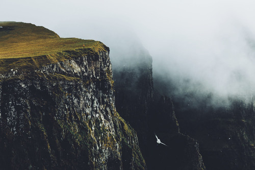 a cliff with fog and grass.jpg