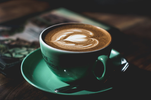 a cup of coffee with a heart shaped foam in it.jpg