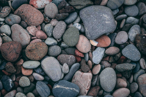 a group of rocks on a beach.jpg