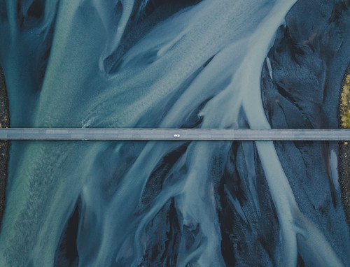a road with a road in the middle of a river.jpg