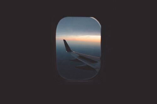 an airplane wing seen through a window.jpg