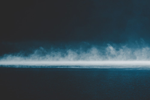 a fog over water with a black background.jpg