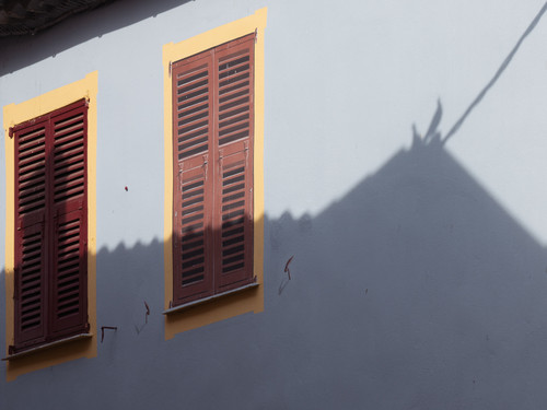 a building with shutters on windows.jpg