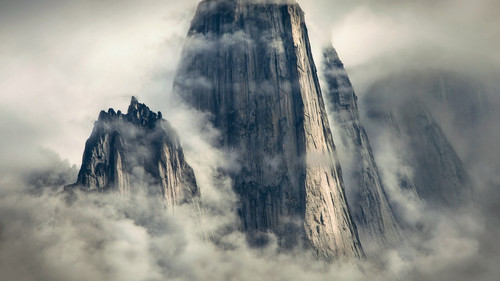 a tall mountain with clouds.jpg