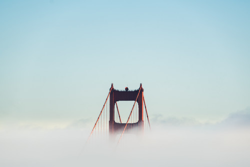 a bridge with clouds in the sky.jpg