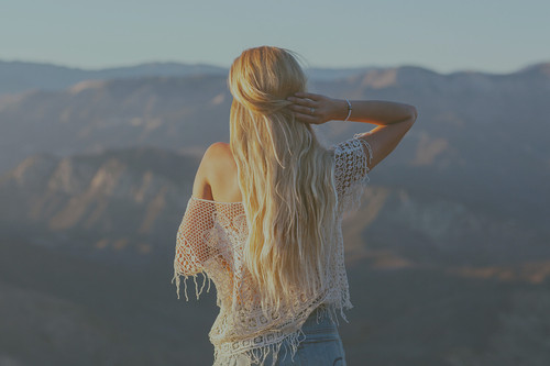a woman standing on a mountain.jpg