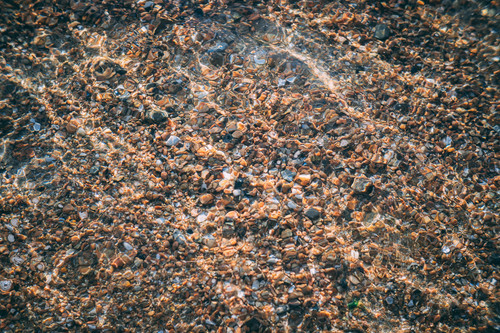 a close up of rocks under water.jpg