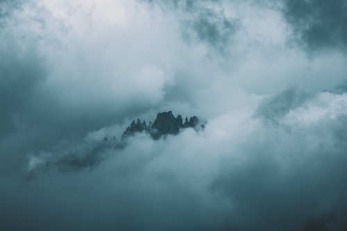 a mountain with clouds in the sky.jpg