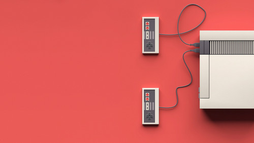 a video game controller connected to a cord.jpg
