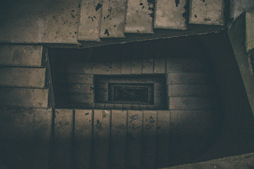 a spiral staircase with a square hole in the middle.jpg