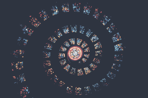 a circular pattern of stained glass with Thanks Giving Square in the background.jpg