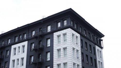 a black and white building with a fire escape.jpg