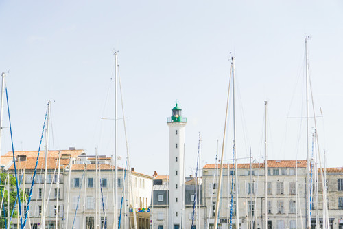 a lighthouse in front of a building.jpg