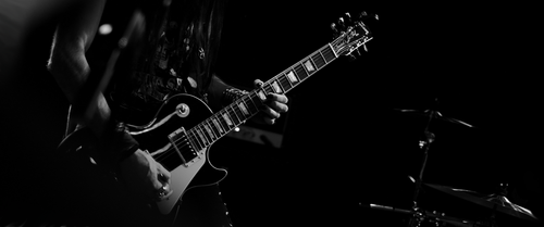 a person playing a guitar.png