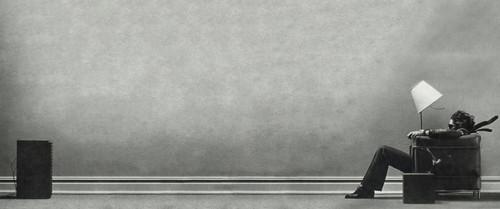 a man standing in a corner of a wall.jpg