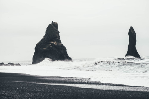 a large rock in the ocean.jpg