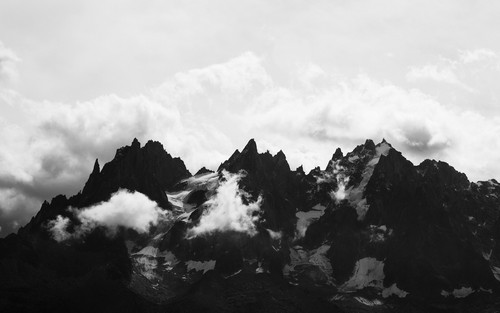 a mountain range with clouds.jpg