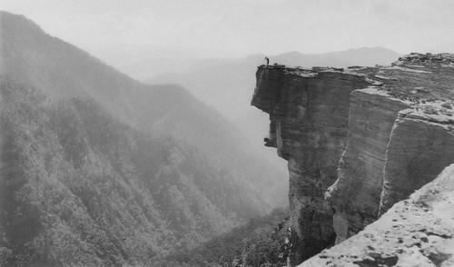 a person standing on a cliff edge.jpg