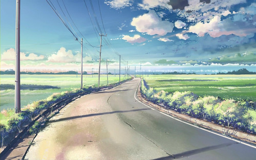 a road with power lines and grass fields.jpg