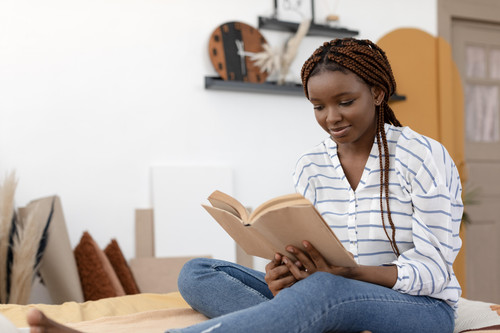 medium shot woman reading book.jpg